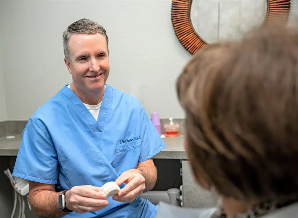 cosmetic dentist in Garland, TX, with a patient