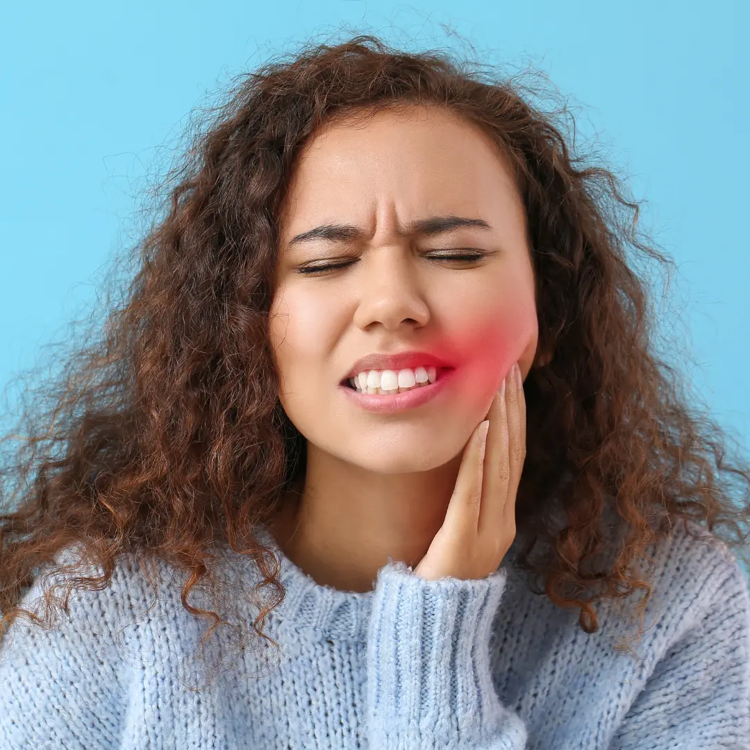 patient with tooth ache needing to see an emergency dentist in Garland, TX